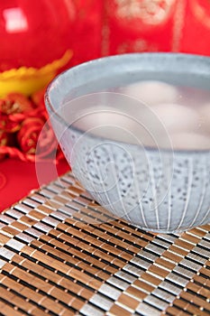 A bowl of dumplings or Lantern Festival on a festive background