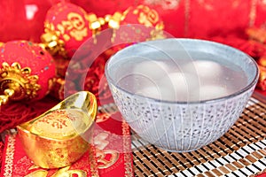 A bowl of dumplings on the red background