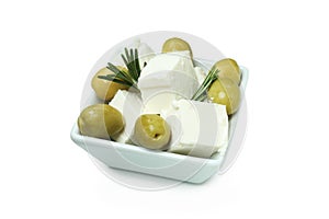 Bowl with feta cheese, olives and rosemary isolated on white background