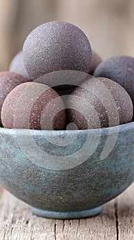 Bowl filled with carp fishing boilies crafted for effective baiting strategies photo