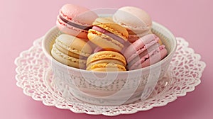 A bowl filled with colorful French macaroons sits elegantly on a delicate lace doily