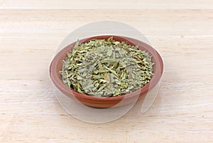 Bowl filled with cut and sifted senna leaf