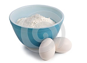 Bowl filled with flour and eggs