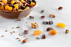 A bowl filled with homemade sweet and salty trail mix ready for snacking.