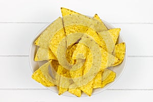 Bowl filled with tortilla chips top-view