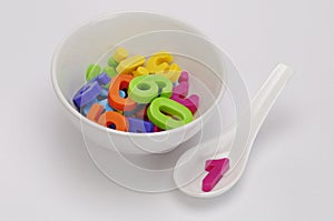 A bowl filled with toy numbers and figures. An idea for â€˜hungry for knowledgeâ€™ kids