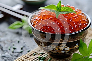 A bowl filled with vibrant red berries sits prominently on top of a sturdy table