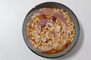Bowl with Fish pasta soup. A Portuguese typical dish called massada de peixe photo