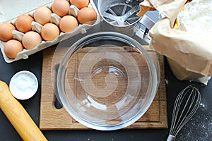 A bowl of flour and egg on the kitchen table