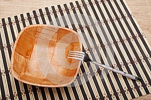 Bowl and fork on the table