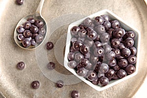 Bowl with fresh acai berries on tra