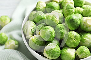 Bowl of fresh Brussels sprouts on fabric