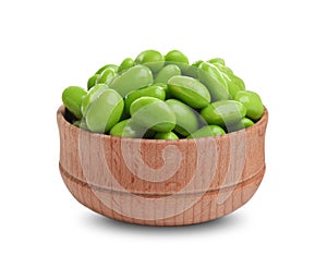 Bowl with fresh edamame soybeans on background