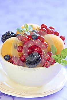 Bowl with fresh fruits and berries