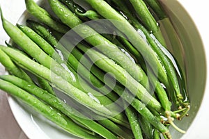 Bowl with fresh green French beans
