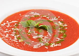 Bowl with fresh homemade tomato soup on table, closeup