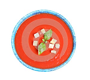Bowl with fresh homemade tomato soup on white background