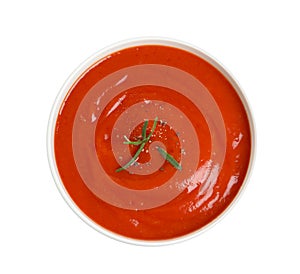 Bowl with fresh homemade tomato soup on white, top view