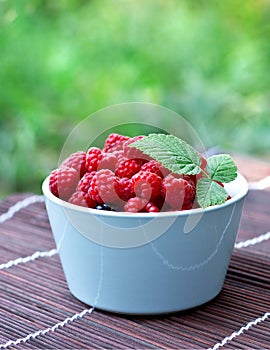 Bowl with fresh raspberry