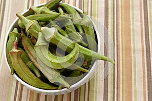 Bowl of fresh raw okra closeup