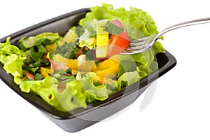 Bowl of fresh salad and fork