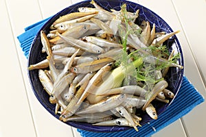 Bowl of fresh sprats photo