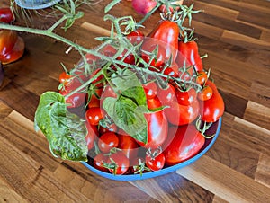 A bowl of fresh tomatoes on a table