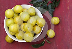 Bowl of fresh yellow plums