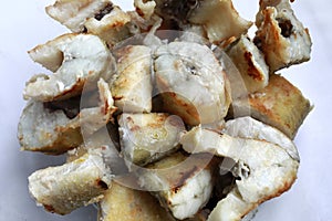Bowl with fried navaga fish