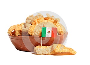 Bowl of Fried Pork Skins With Flag of Mexico Isolated on White Background