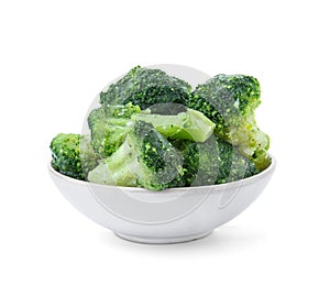 Bowl with frozen broccoli on white background