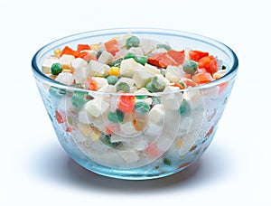 Bowl with frozen vegetables on a white background