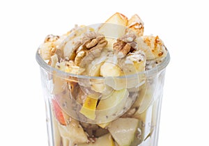 Bowl of fruit salad isolated on white