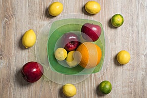 Bowl of fruit. Set of citrus fruits and red apples