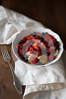 A bowl of fruits and berries