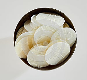 Bowl of consecrated Hosties for Holy Communion photo