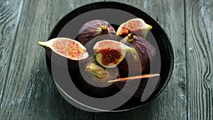 Bowl full of cut figs
