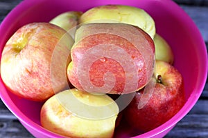 Bowl full of Egyptian fresh Apples, An apple is a round, edible fruit produced by an apple tree (Malus domestica)