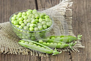 A bowl full of green peas