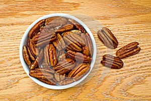 Bowl Full of Healthy Pecans on an oak table