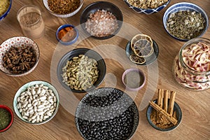 Bowl full of ingredients, black beans, white beans, cinnamon stick, smelly