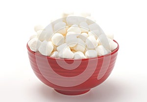 Bowl Full of Mini White Marshmallows on a White Background