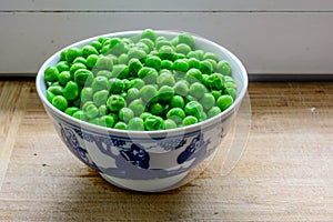 a bowl full of peas
