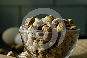 a bowl full of soya bean chunks and eggs at background