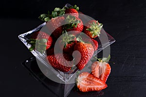 Bowl of glass with strawberries photo