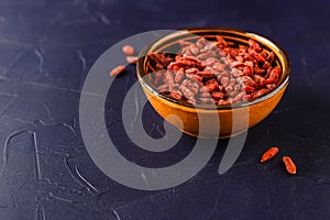 Bowl with goji berries on the table