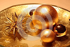 Bowl with golden Christmas decoration