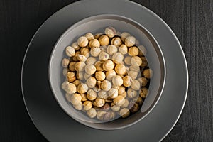 Bowl gray with hazelnuts photo