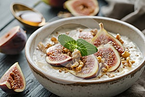 Bowl of Greek yogurt with honey- walnuts and sliced fig.