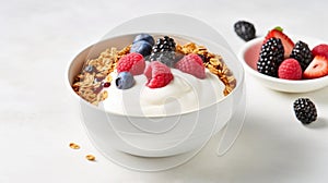 A bowl of Greek yogurt topped with granola, mixed berries, and a drizzle of honey